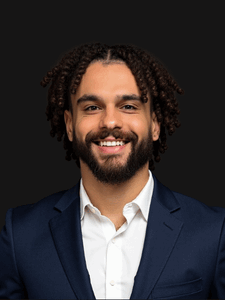 Professional photo of Tanthony, industrial employment specialist. He is a young man with dark hair. He is dressed in business professional clothes. 