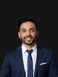 Professional photo of Jonathan. Jonathan is a young man with dark hair. He is dressed in business professional attire.