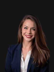 Professional photo of Brittany. Brittany is a middle-aged woman with blondish-brown hair. She is dressed in business professional attire.